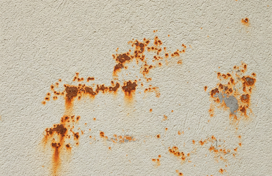 Rust on Stucco Wall rust on the side of a house